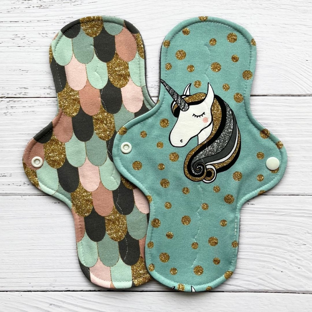 two reusable pads in a sweet and glamorous theme
