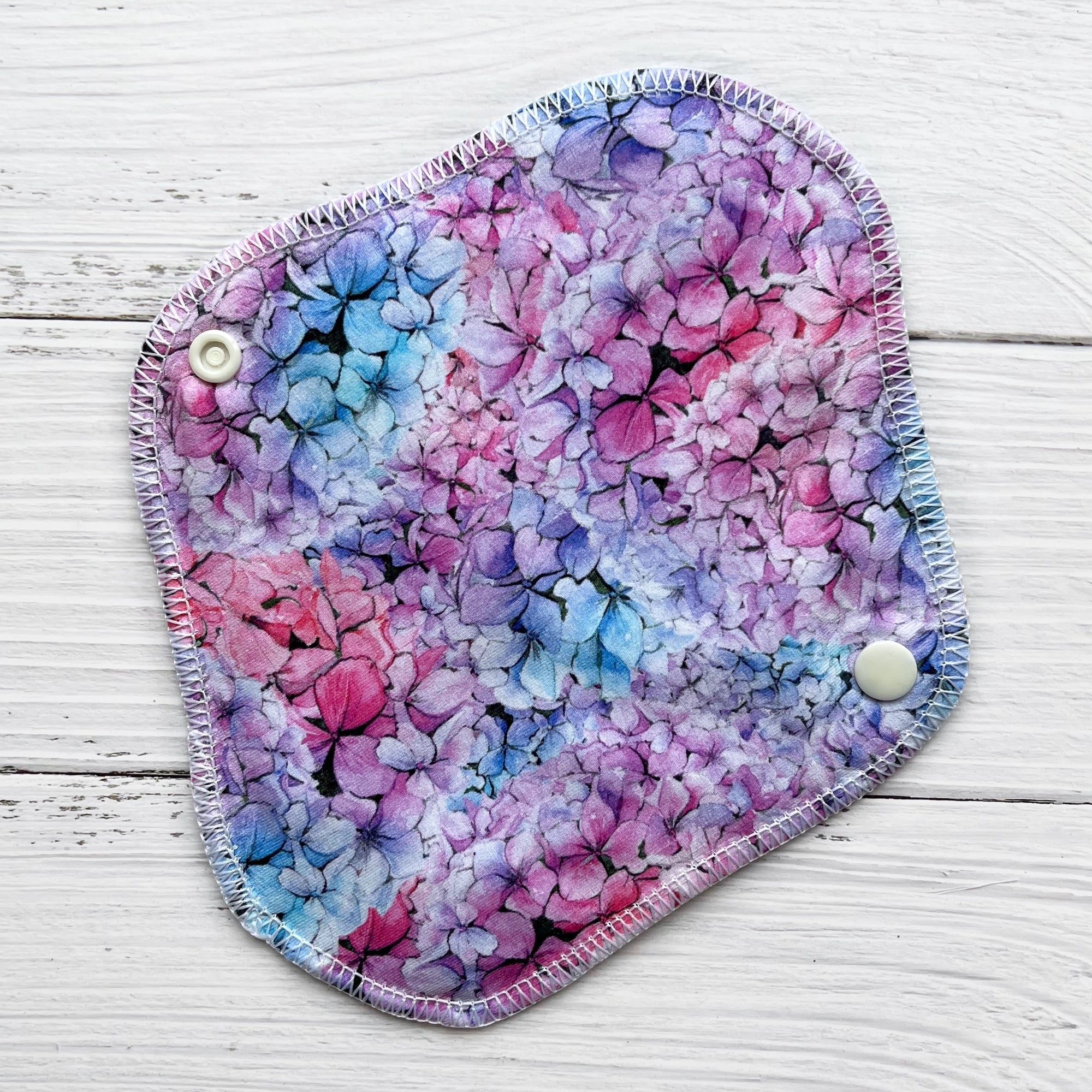 reusable pantyliner in a pink blue and purple hydrangea print