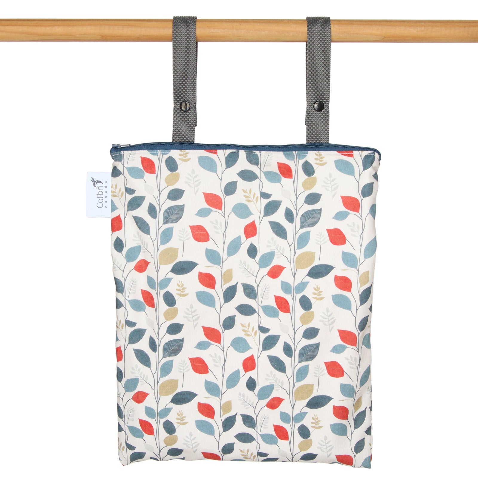 Patterned bag with leaf design hanging on a wooden rod