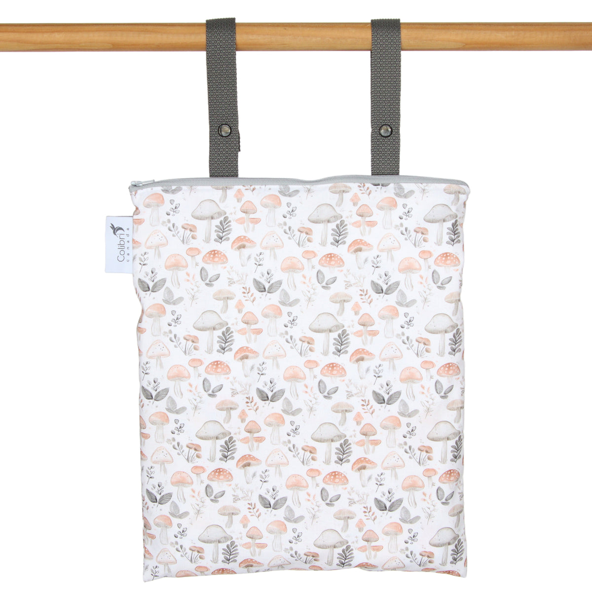mushroom-patterned hanging bag with a wooden rod on a white background