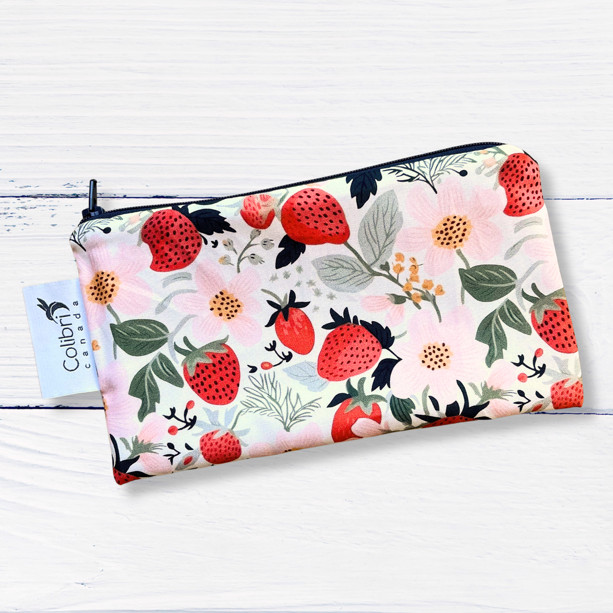 small zippered pouch with strawberry pattern on a white background