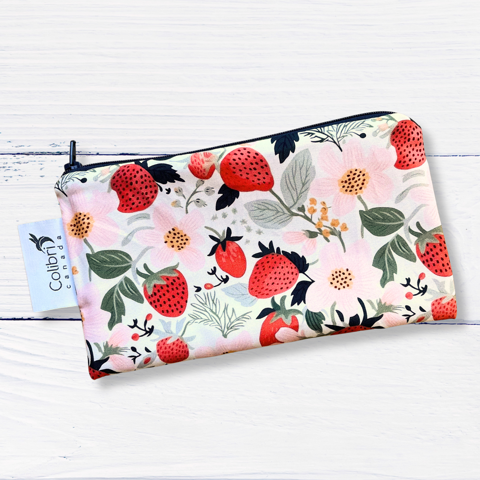 small zippered pouch with strawberry pattern on a white background