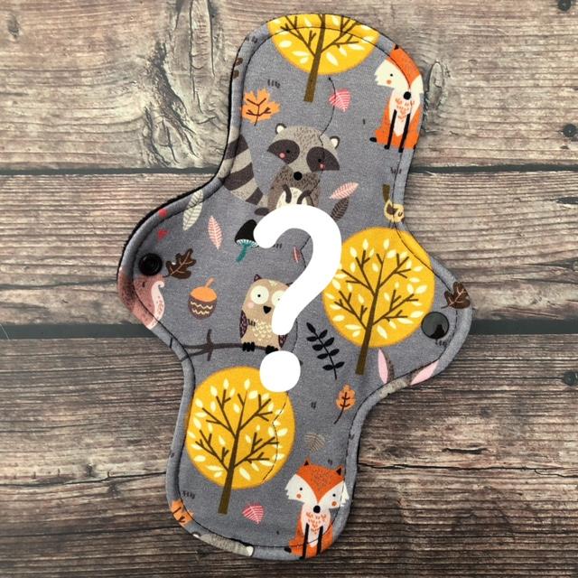 reusable pad subscription featuring a cute animal print with raccoon, owl, fox and trees