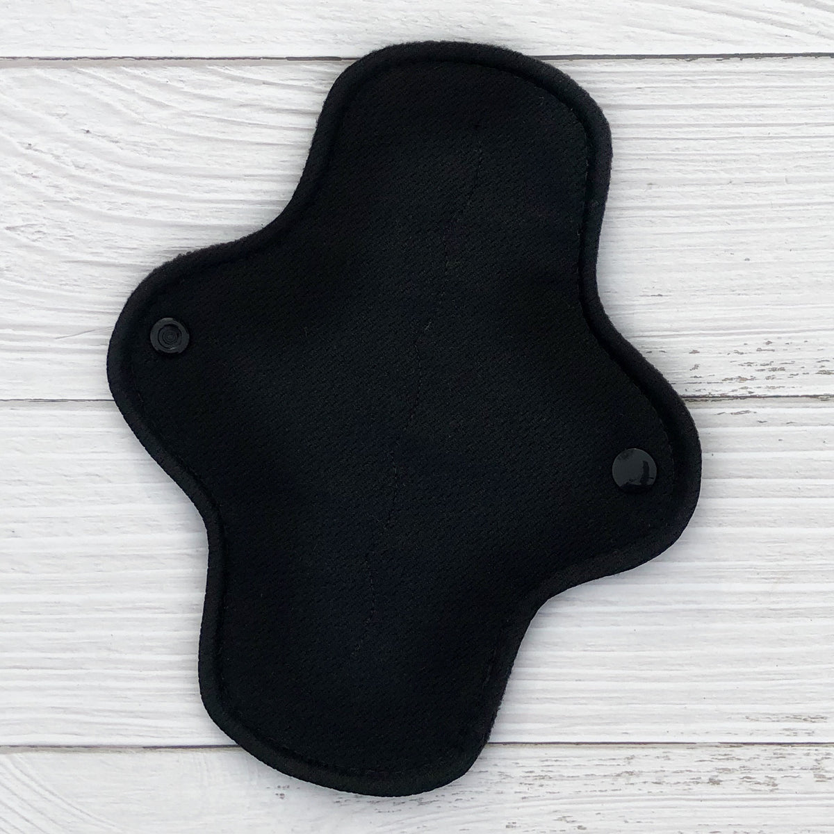 light absorbency reusable cloth pad with black athletic wicking jersey